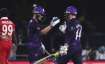 Scotland's batsman Matthew Cross, left, celebrates with teammate Richie Berrington for scoring the w