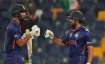 India's KL Rahul, left, and India's Rohit Sharma celebrate scoring runs during the Cricket Twenty20 