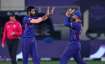 India's Jasprit Bumrah, left, celebrates the dismissal of Scotland's captain Kyle Coetzer with capta