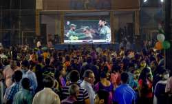 Cricket fans watch the World Cup T20 match of India and