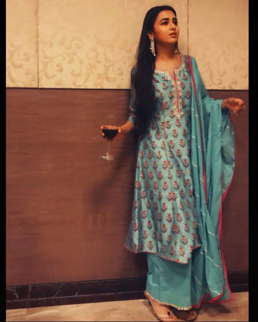 Whats better than a candid picture of a girl dressed in ethnic with a wine glass in her hands