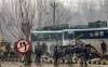 Security personnel carry out rescue and relief works at the