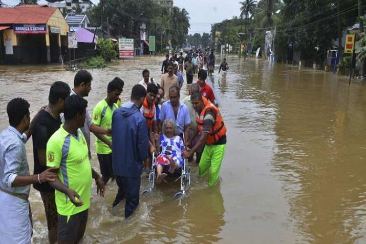 An elderly woman is evacuated towards safer area in