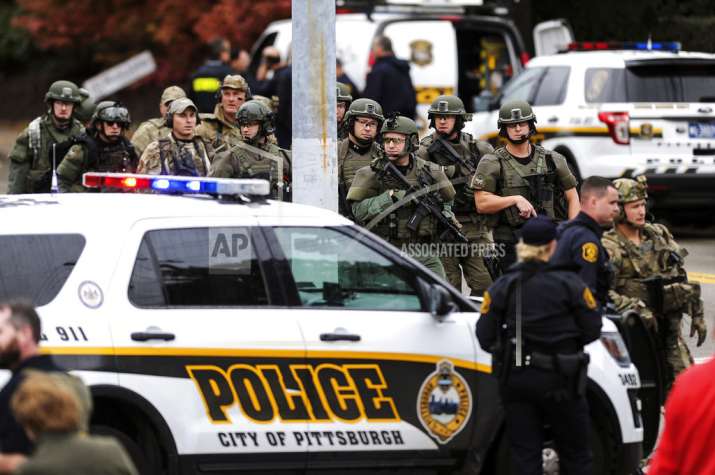 Law enforcement officers secure the scene where multiple