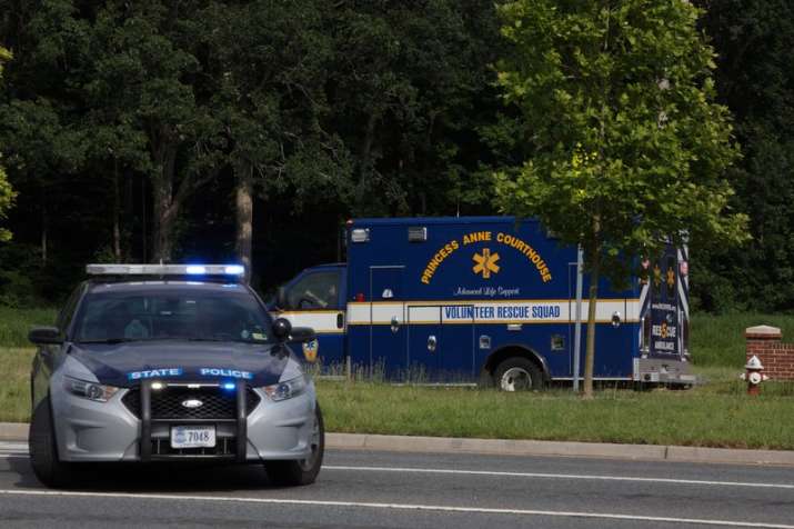 An ambulance turns on Nimmo Parkway following a shooting at